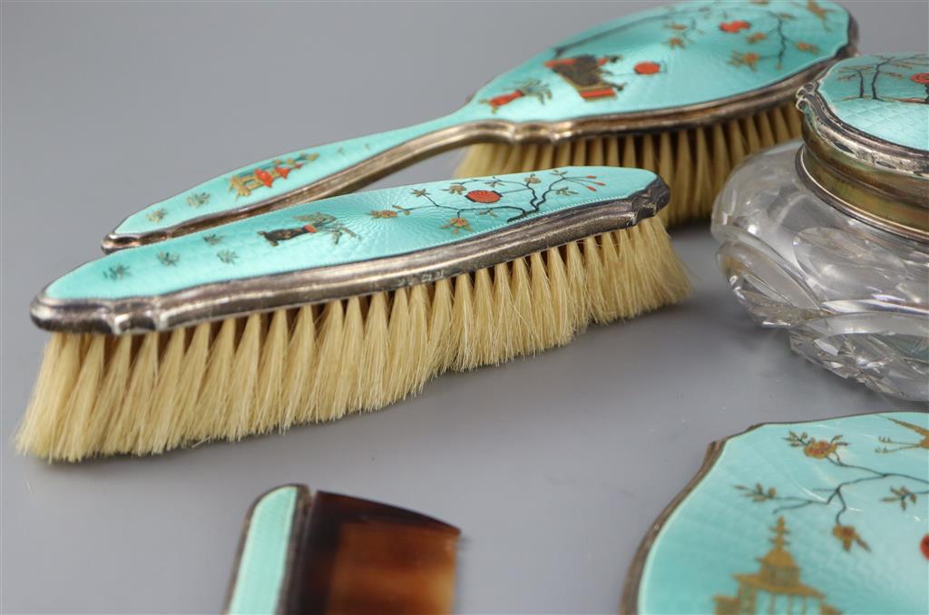 A 1920s silver and gilded chinoiserie guilloche enamel eight piece dressing table set, by Adie Bros,